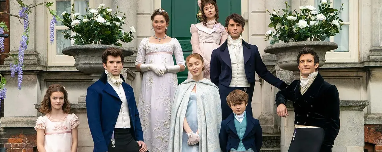 The Bridgerton family in Regency dress on the steps of their London house